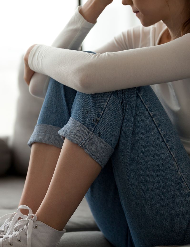 Person in solitude processing grief and loss - finding compassionate bereavement support through counseling