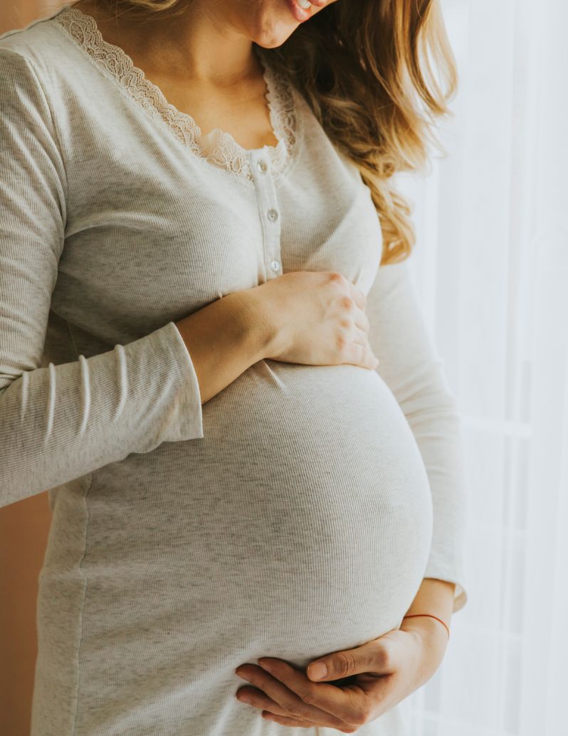 Pregnant woman receiving perinatal mental health support - PMH-C certified therapy for pregnancy anxiety, depression and maternal wellness